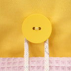 Detail der Fundertable Befestigung in Gelb mit Knopf und Kordel