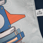 Close-up of Fundertable space-themed window panel with rocket illustration and fabric texture